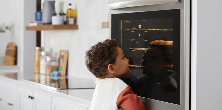 kid-watching-air-fryer-oven
